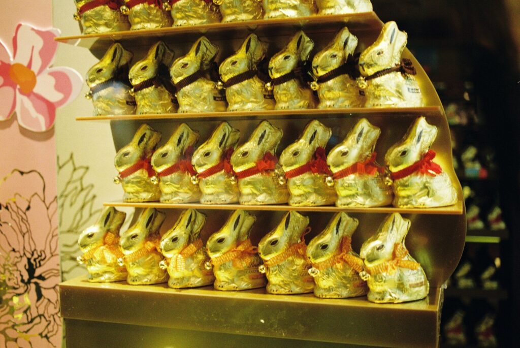 Rows of golden chocolate bunnies on shelves